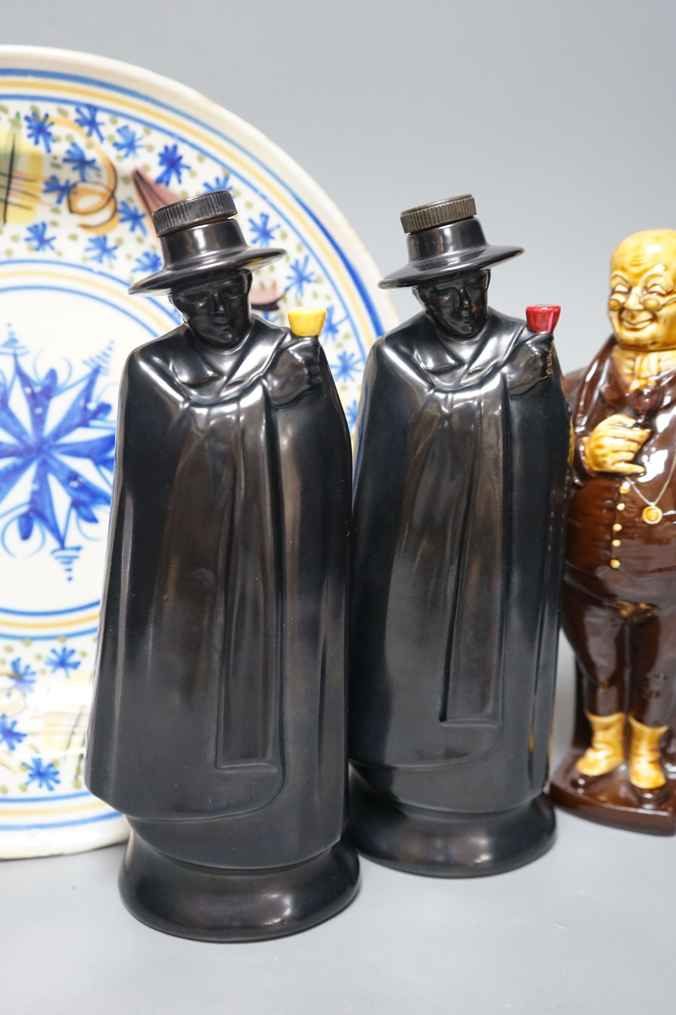 Two Doulton Sandeman bottles, a Dicken’s character bottle, and a Spanish maiolica dish, Sandeman bottles 27cms high